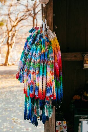 Colorful paper crane birds Origami paper hanging at Buddhist temple or Shinto shrine in Japan.の写真素材