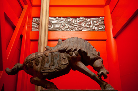 Tokyo, Japan - December 4, 2018 : Old antique bronze war horse god animal statue at Kanda Myojin Shrine main gate.のeditorial素材