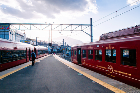 Otsuki, Japan - NOV 30, 2018 : Japanese passenger at quiet Otsuki station platform under warm sunlight. Interchange station between JR and Fujikyu - Fuji Tozan Densha line.のeditorial素材