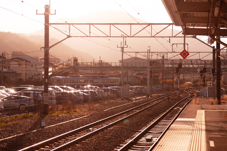 Otsuki, Japan - NOV 30, 2018 : Empty Japan Otsuki train station platform warm sunlight in winter. Interchange station between JR and Fujikyu - Fuji Tozan Densha line.のeditorial素材
