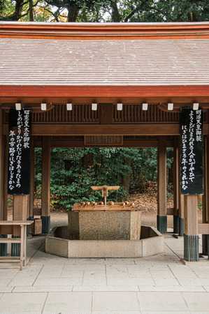 DEC 5, 2018 Tokyo, Japan - Meiji Jingu Shrine Historic Wooden Temizuya or sacred water pavilion  - Most important shrine and city green space of Japan capital city.のeditorial素材