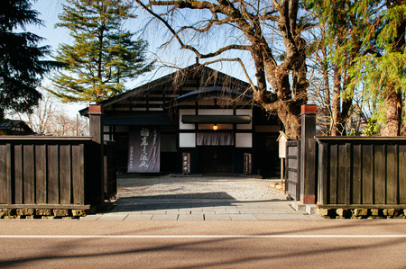 DEC 3, 2018 - Kakunodate, Japan - Kakunodate old Samurai town famous vintage Edo houses that became museum with big tree in Akita, Tohoku regionのeditorial素材