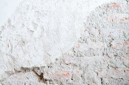 Grey coloured light tone rough grungy ruin textured old concrete wall background wallpaper
