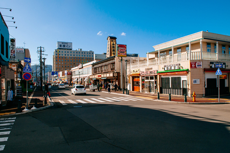 DEC 2, 2018 Hakodate, JAPAN - Asaichi morning fish market and Kaiko street junction under bright sunlight with tourists walking  on sidewalkのeditorial素材