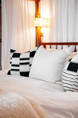 JUN 18, 2011 Serengeti, Tanzania - Luxury African asian contemporary hotel bedroom with wooden four...