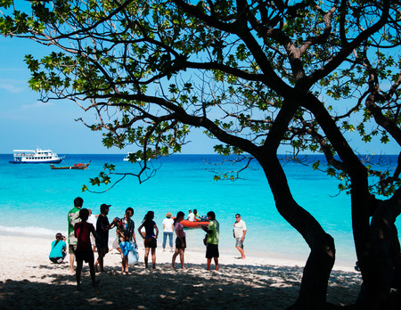 DEC 21, 2009 Phang Nga - Phuket, Thailand -Many tourist on Similan island white sand beach and vibrant turqouise blue Andaman sea.のeditorial素材