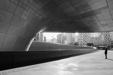 DEC 11, 2015 Seoul, South Korea - Dongdaemun design plaza or DDP modern free from building architecture in black and white with metalic entrance tunnel was designed by Zaha Hadidのeditorial素材