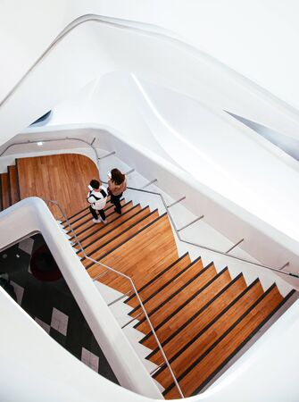 DEC 11, 2015 Seoul, South Korea - People walking on Spiral stair of Dongdaemun design plaza or DDP modern free from building architecture was designed by Zaha Hadidのeditorial素材