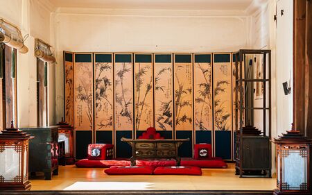 DEC 16, 2016 Seoul, South Korea - Traditional Hanok style Korean House interior with antique furnitures at Namsan Hanok village seen through window frame.のeditorial素材