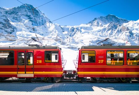 Red train of Jungfrau Bahn at Kleine Scheidegg station. The main transportation to Jungfraujochのeditorial素材