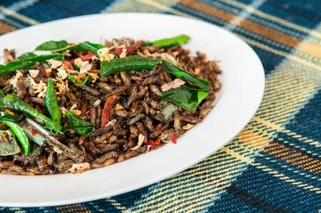 Deep fried crickets with herbs and chili. Thailand insect recipe street food in white dishの写真素材