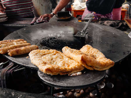 Crispy fried Naan bread or Roti in India, Bangladesh, Sri Lanka or Pakistan. South Asian street...