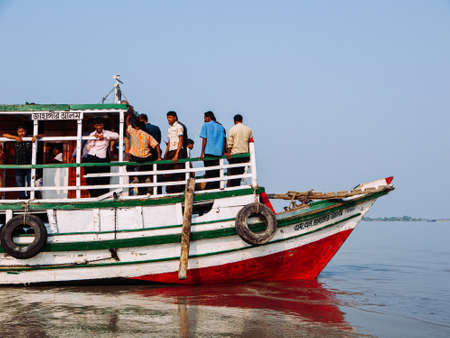 FEB 15, 2012 Dhaka, Bangladesh - Many Bangladesh people riding on commuter river ferry boat in...