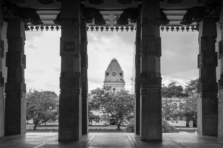 JUL 3, 2012 Galle, Sri Lanka - Colombo independence memorial hall and Western Provincial Council Secretariat building seen through stone pillars. Black and whiteのeditorial素材