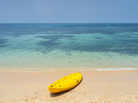Yellow Kayak boat on tropical island beach white sand under bright sun in summer season. Koh Kood - Thailandの写真素材