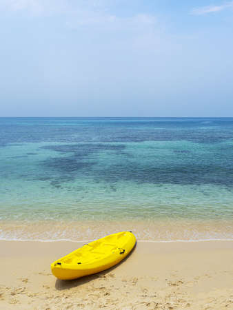 Yellow Kayak boat on tropical island beach white sand under bright sun in summer season. Koh Kood - Thailandの写真素材