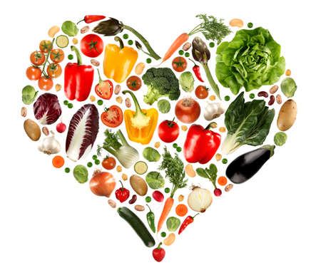 An heart maked with various vegetables isolated on white.の写真素材
