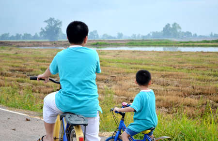 Asian boys on the field , Thailandの写真素材