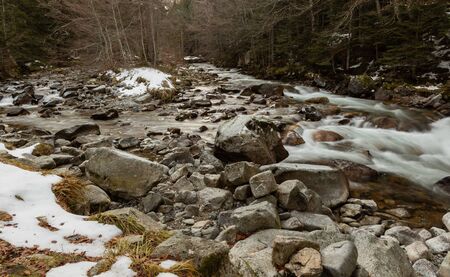 Winter mountain river banks in Pyrenees Franceの写真素材