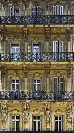 Facade of antique buiding with wooden windows.の写真素材