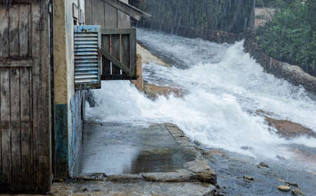 Scene showing flooding on a street with buildingsの写真素材