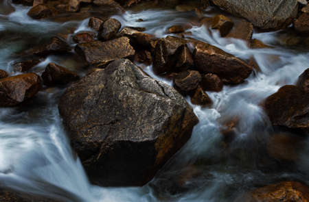 Long exposure of water stream and rocksの写真素材