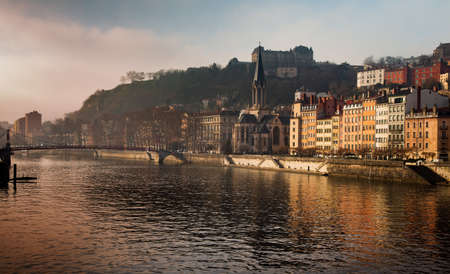 France Lyon old buildings along the river Saone with bridgeの写真素材