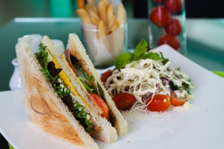 Chicken club sandwiches with potatoの写真素材