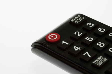 tv remote control keypad black on white isolatedの写真素材