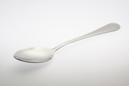 a silver spoon isolated on white backgroundの写真素材