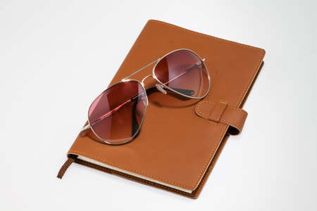 notebook with sunglasses