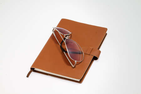 notebook with sunglasses