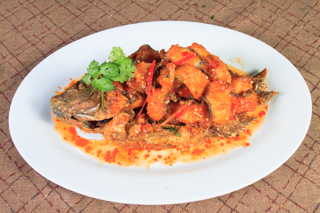 Thai food style: Fried river fish with garlic and pepperの写真素材