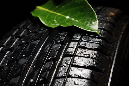 Car tires close-up on black backgroundの写真素材