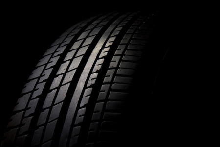 Car tires close-up on black backgroundの写真素材