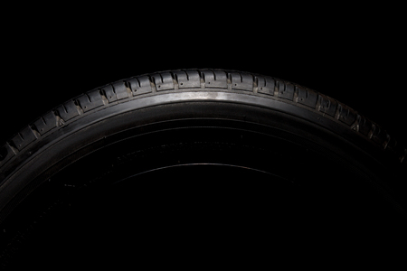 Car tires close-up on black backgroundの写真素材