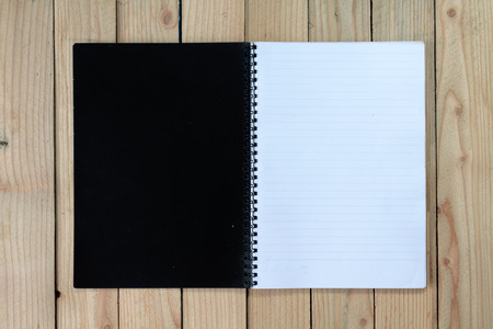 notebook on wood background