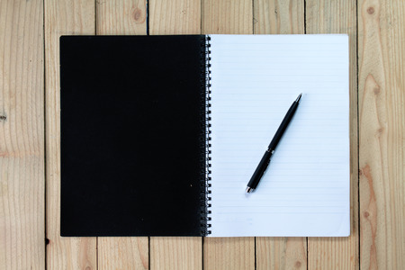 notebook on wood backgroundの写真素材