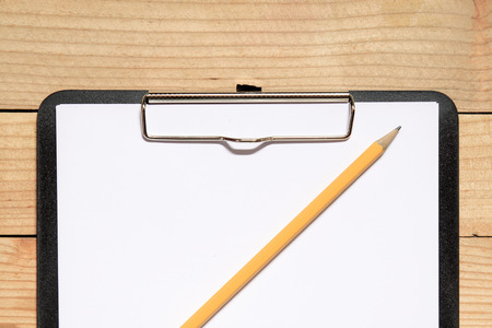 Black record board with white paperの写真素材