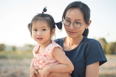 Asian woman and Asian child happiness together.の写真素材