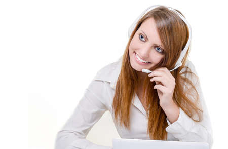 Smiling attractive call center agent with headphone isolatedの写真素材