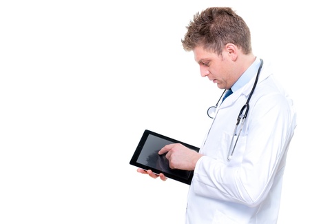 Portrait of handsome male doctor touching digital tabletの写真素材