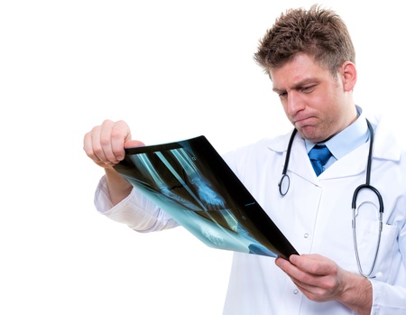 attractive male doctor examining  x-ray