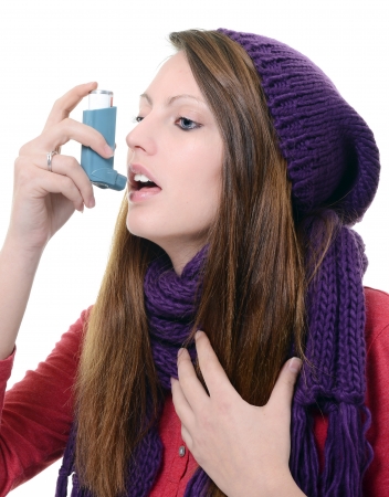 Woman with asthma using pump inhalerの写真素材