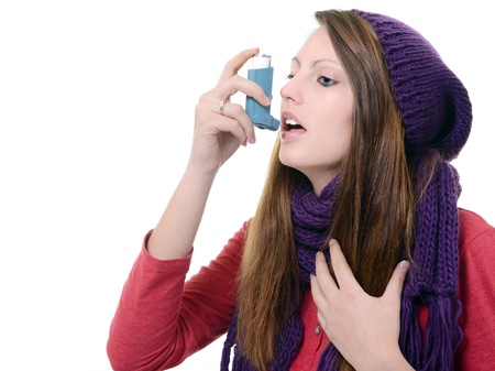 Woman with asthma using pump inhalerの写真素材