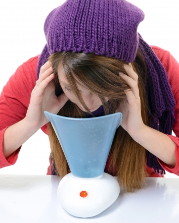 A young woman with colds and flu inhaled essential oilsの写真素材