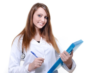 Pretty female doctor isolated writing notesの写真素材