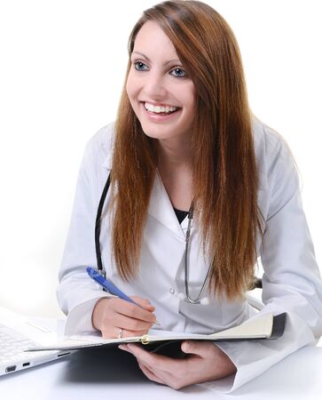 Pretty female doctor isolated writing on scheduleの写真素材