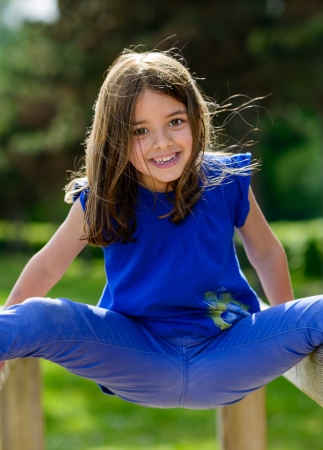beautiful portrait of cute child playing with greenery in the backgroundの写真素材
