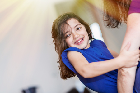 complicity between a very cute little girl and her motherの写真素材